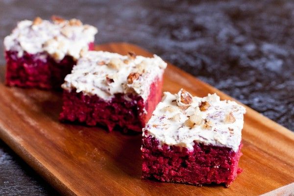 Cut out squares of beetroot red velvet cake