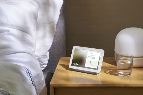 A Google Nest Hub on a bedside table